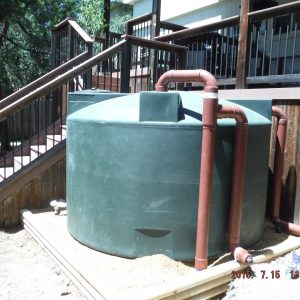 1500 gallon Dark Green rainwater collection tank installation