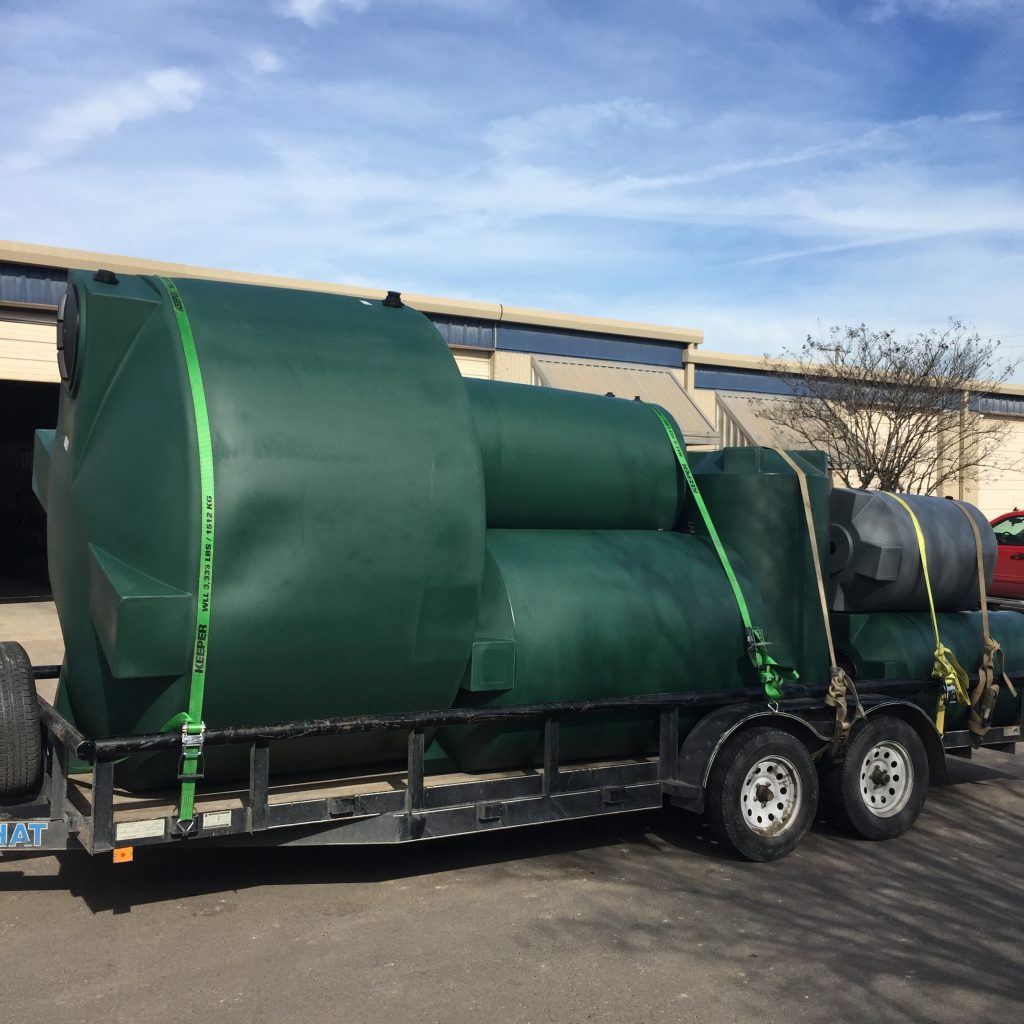 Trailer full of poly tanks